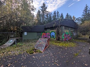 Abandoned air base 5 Abandoned building with graffiti in a forest setting. Perfect for urban exploration and plotting on a lost place map.