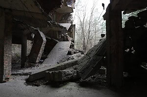 Crumbling concrete structures in a forest, perfect for urban exploration and finding lost places on a map.
