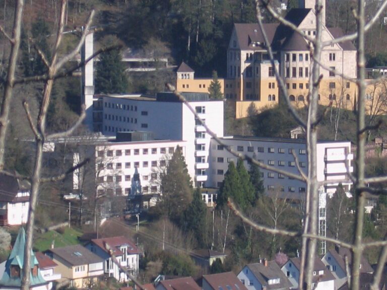 Picturesque hillside architecture blending modern, traditional buildings, European landscape, urbex exploration.